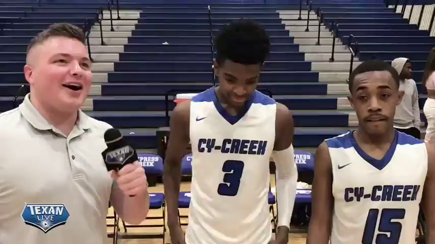 Chase Snyder talks to Cy Creek Chase Kelly and Ej Lusk after their 61-56 Victory